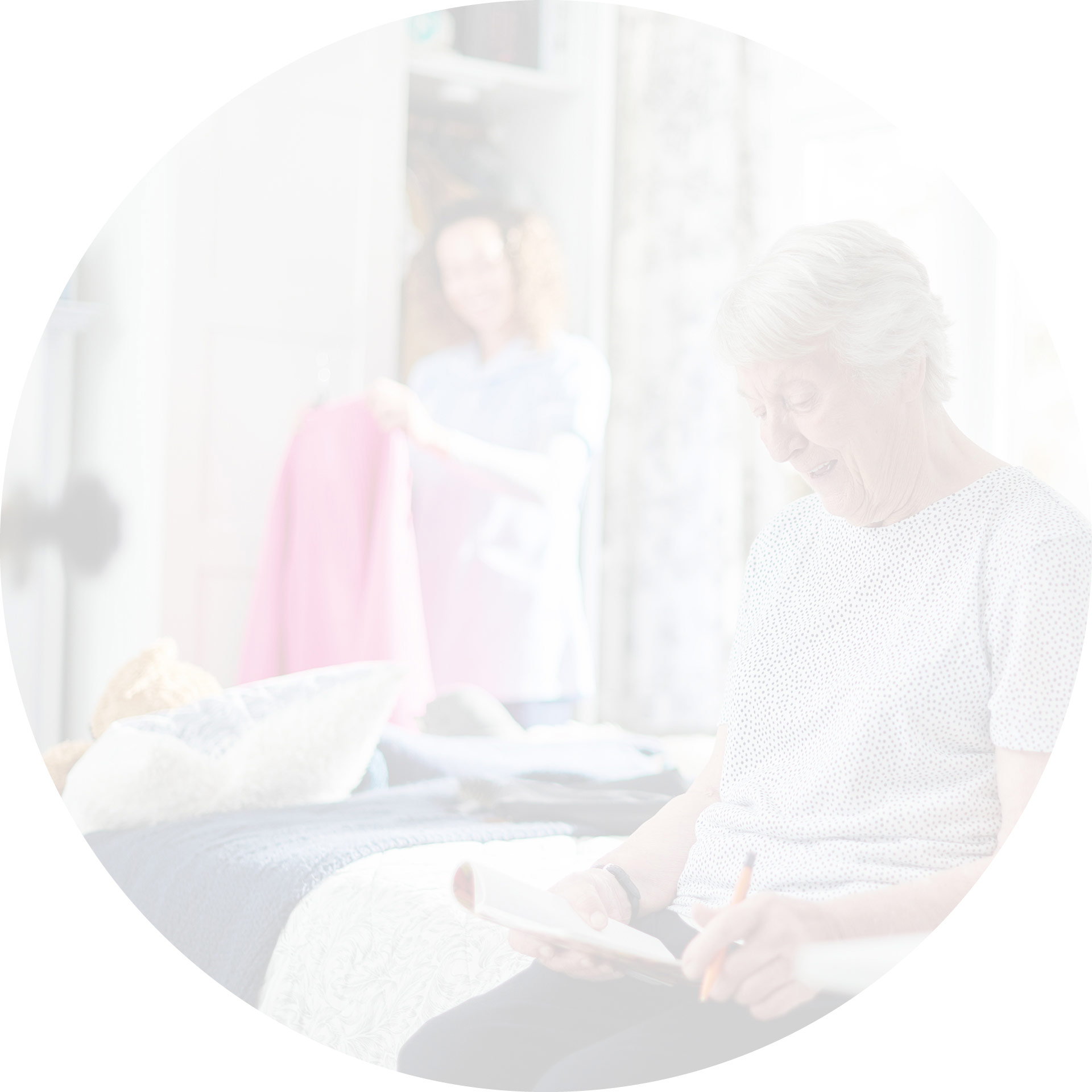 An elderly lady chatting with her carer