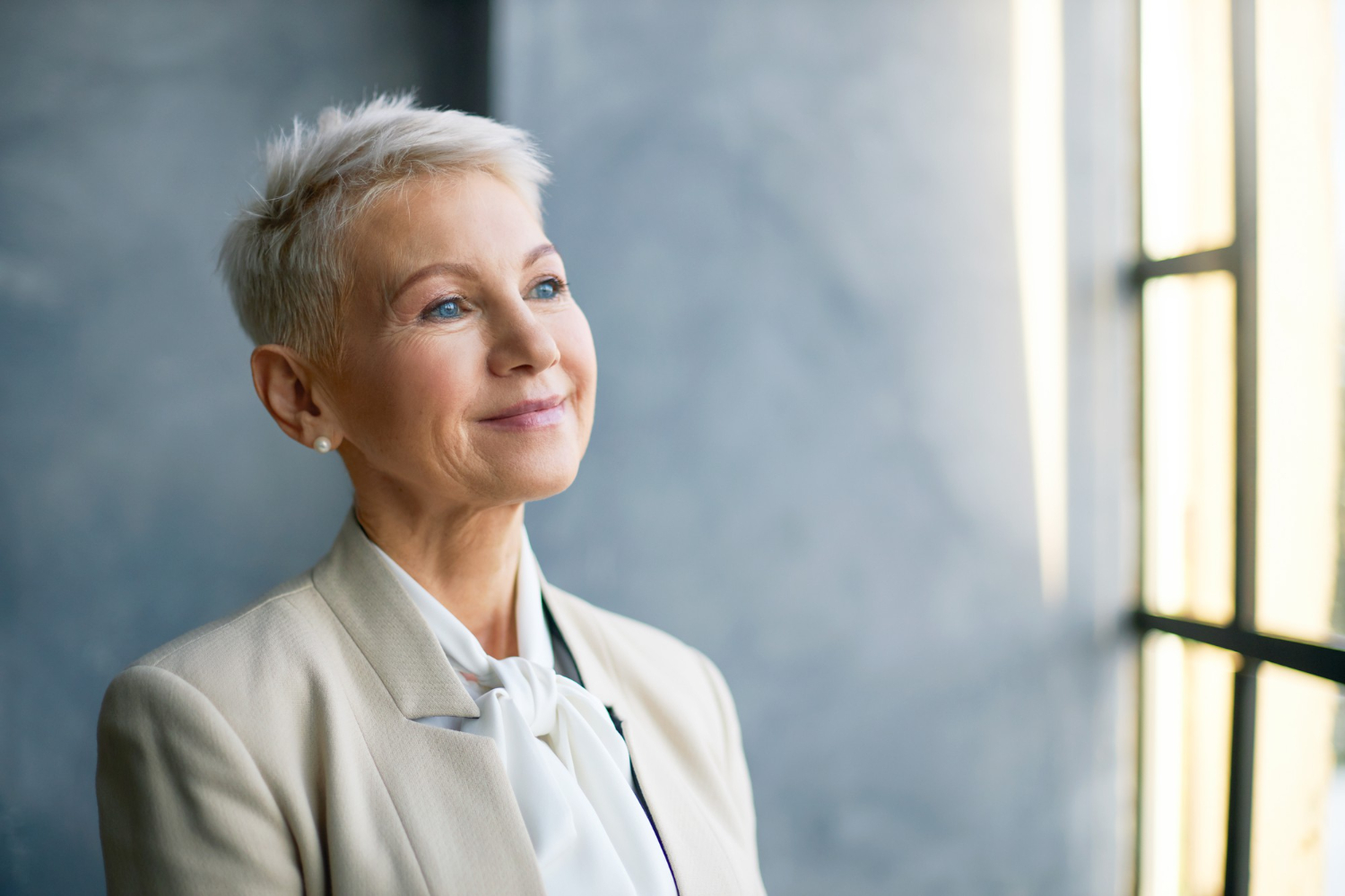 An elderly lady looking confident and sure she has chosen the right home care agency. 