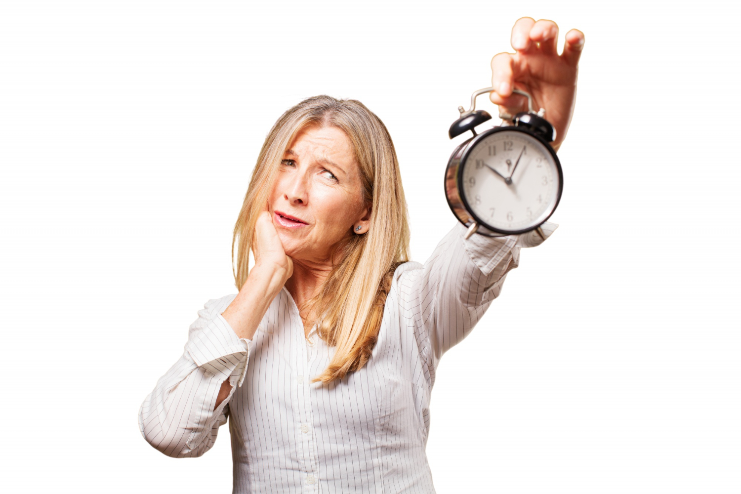 A home care agency owner looking worried while holding up an alarm clock.